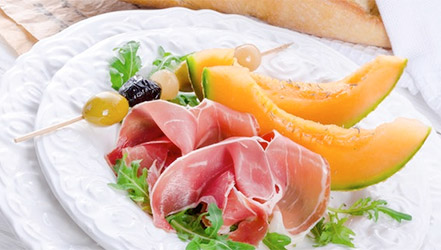 Melon with ham and olives