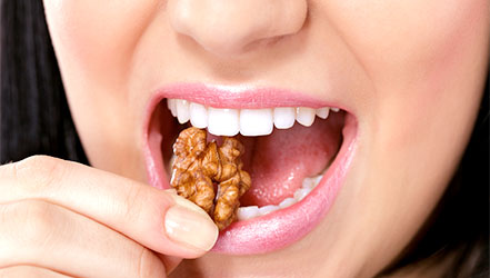 Girl eating walnuts